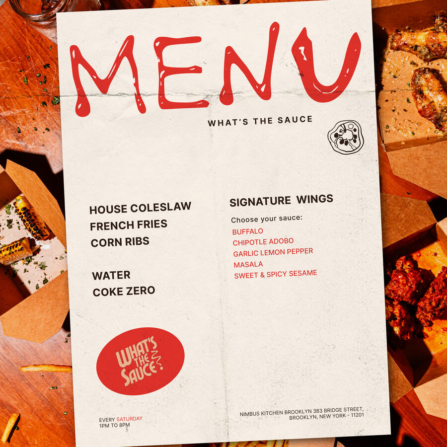 What's The Sauce printed menu on a table of wings and fries